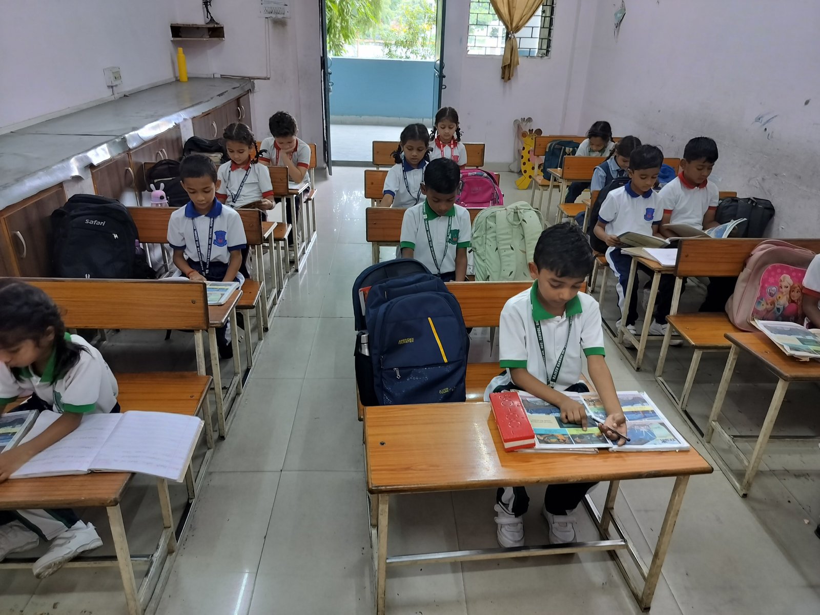 Primary students learning independently in a bright RGHSS classroom